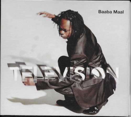 Allmusic album Review : On Television, Baaba Maal collaborates with Didi Gutman and Sabina Sciubba of New Yorks Brazilian Girls to fashion an album that combines subtle electronica with his own kind of Senegalese pop. The album took three years to record, and one track, the softly percolating dance tune "International," appeared the previous year on the Brazilian Girls CD New York City. The tune is club-friendly, with Maal delivering an unusually subdued vocal. The mix here is shorter and lacks the dub-like effects the Brazilian Girls dropped between verses on New York City. The album opens with the title track, a Maal/Brazilian Girls collaboration. A muted guitar figure that sounds like a music box floats below a funky samba-like beat. The African percussion embroiders the mix without overwhelming the bouncy club pulse. "Tindo" blends a drum loop, talking drum, and electric bass to propel the subtle intertwining vocals of Maal and Sciubba. "Miracle" sounds like South African jive. Long sustained electric guitar notes introduce this lilting, happy dance tune and Maal and Sciubba turn in a playful duet that skims across the glittering surface of the music. "Cantaloupe" was written by Maal, Gutman, and Barry Reynolds, the guitar player with the legendary Compass Point studio band. The melody has the Latin/Caribbean feel typical of American 30s movie musicals, while Maal contributes a traditional Senegalese vocal. A programmed rhythm track starts about midway through, to add a modern element to another laid-back track. Maal and Sciubba co-wrote "A Song for Women," a tune praising the power of African women, and its another surprisingly mellow effort. Maals vocals float in and out of the mix in a dub-like manner; hand percussion accents the songs drum loop without overwhelming its steady thrum. The album closes with two simmering acoustic tracks. "Dakar Moon," sung by Maal partially in English, has a vague Caribbean lilt that recalls the Cuban hotel music of the islands pre-revolutionary past. Sounds of nature -- the wind in palm trees, the shushing of the tide -- fill the background with Barry Reynolds adding some flamenco-flavored guitar. "Tindo Quando," another take on "Tindo," features Maals acoustic guitar and a subtle balafon supporting the vocals of Maal and Sciubba. Sciubba sings a counter-melody in Italian to complement Maals Fonyi vocal. Both singers hold back to show off the softer, melodic side of their vocal prowess. television