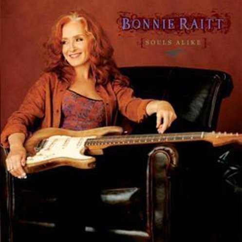 Allmusic album Review : Souls Alike is the first album in Bonnie Raitts 18-disc catalog to bear her own name as producer with some assistance from Tchad Blake. It is also the first album in her career absent a 12-bar blues. Gone are the big washes of sound that Don Was added to her Grammy-winning recordings, and the sound Raitt has chosen for herself is a bit edgier, far more adventurous than Silver Lining, her last studio offering produced by Blake. Guitars -- courtesy of the artist and George Marinelli -- dominate, and are accented by Jon Clearys Hammond B3, which paints the entire proceeding with a solid, somewhat funky yet outsider soul feel. Raitt keeps everything close to the vest this time out. Her road band and a handful of guests who include Mitchell Froom, Maia Sharp, David Batteau, and Sweet Pea Atkinson carried this project to fruition. Whats most remarkable about Souls Alike is its songs and their focus on broken love, acceptance of responsibility, and the willingness to transcend. Cleary, Sharp, and Batteau wrote a number of tracks, as did John Capek, who provides drum loops on some cuts. Its all in the family for the most part. The songs themselves reflect on self-determination (the gorgeous title cut) in Raitts trademark rock ballad style, Randall Brambletts greasy, dark and slinky "God Was in the Water," the angular, ultra-modern "Crooked Crown," the grimy New Orleans second-line groove of Clearys "Unnecessary Mercenary" with a killer slide break by Raitt and an off-the-rails piano by Cleary. Then theres the near-trip-hop of "Deep Water," a deeply sensual tune that is a shock on first listen but infectious thereafter. "The Bed I Made," by Sharp and Batteau is the albums closer. With a shimmery loop and Raitts finest vocal on the set, its a faux jazz-ballad that is unsettling, full of bittersweet regret and the willingness to embrace the face in the mirror and the mistakes as a way of moving through pain. Its a rather unsettling way to end an album, but then, this entire disc is brave and sharp. It marks a new turn for Raitt and offers her and her fans an entirely new road to go down -- this one deep into the heart. souls_alike