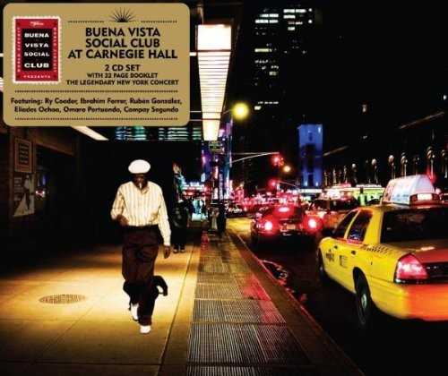 Allmusic album Review : It seems very strange that World Circuit/Nonesuch would wait ten long years to issue this historic document of the grand, wildly celebrated Buena Vista Social Club concert at Carnegie Hall. This is the very show so wonderfully and artfully detailed by filmmaker Wim Wenders in his documentary on the project that reunited these then-obscure Cuban music legends for an album and a tour and catapulted them to worldwide fame. Perhaps it was worth the wait; perhaps this music should have been in our midst all along. Of the four older legends, those who had made music together in Cuba before Castro, only Omara Portuondo remains on the Earth, and she is still quite active. The other three, vocalist Ibrahim Ferrer, pianist Rubén González, and guitarist and vocalist Compay Segundo, have passed away -- Segundo lived to be 96! The youngster of the group, guitarist Eliades Ochoa, continues to record and tour.<br><br> One thing the music on this lavishly packaged double-disc set does accomplish, however, is reveal without doubt that the music in the film is as profound, sensual, and beautiful as it was when accompanied by images. It is true that eight of the songs that appeared on the eponymous studio album are replicated here, but these live versions blow them away. In addition, the 16 songs here, covering two full discs, offer extended instrumental workouts to go along with the glorious vocals, making each tune -- from the opening "Chan Chan" all the way through to the glorious bolero "Silencio" duet between Ferrer and Portuondo -- reflect all of the lived history not only of the singers, but of the entire era for an audience to behold. Segundos rich and lived-in baritone inhabits disc twos opener, "Orgullecida," so fully that no one should ever be allowed to cover it again. As is the standard for Nonesuch, the sound of the evening is fantastic, the spark in the mix has been left in, and the backing band sounds as varied and tight as it did in the film. The enclosed booklet contains Jon Pareles original New York Times review of the performance and reminiscences from many of those involved in the evening, including Omara Portuondo and producer and backing guitarist Ry Cooder. This set is every bit as necessary as the solo albums by the singers, and perhaps even more than the studio effort. It is not only a historical document; it is a living, breathing piece of work that guarantees the transference of emotion from tape to listener, and cements the Buena Vista Social Clubs place not only in the Latin music pantheon, but in the larger context of popular music history. at_carnegie_hall