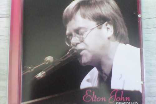 Allmusic album Review : Rarely has a greatest-hits collection been as effective as Elton Johns first compilation of Greatest Hits. Released at the end of 1974, after Goodbye Yellow Brick Road and Caribou had effectively established him as a superstar, Greatest Hits is exactly what it says it is -- it features every one of his Top Ten singles ("Your Song," "Rocket Man," "Honky Cat," "Crocodile Rock," "Daniel," "Goodbye Yellow Brick Road," "Bennie and the Jets," "Dont Let the Sun Go Down on Me"), plus the number 12 "Saturday Nights Alright for Fighting" and radio and concert favorite "Border Song." Despite the exclusion of a couple of lesser hits from this era, most notably "Levon" and "Tiny Dancer," Greatest Hits is a nearly flawless collection, offering a perfect introduction to Elton John and providing casual fans with almost all the hits they need. greatest_hits