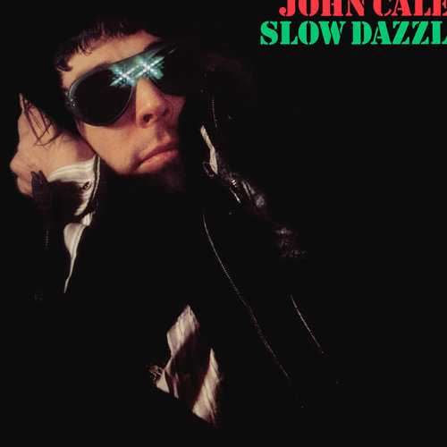 Allmusic album Review : Recording again with Phil Manzanera, along with noted journeyman guitarist Chris Spedding, Cale kept up the focus and amazing music on Slow Dazzle, easily the equal of Fear in terms of overall quality. With Brian Eno again helping out on synth work, Slow Dazzle comes across as a little more fried and unsettling than earlier work. Even the warm, epic lift of the chorus of "Mr. Wilson," very much a tribute to the Beach Boys main man and one of the best hes ever received, is surrounded by strings and piano both lovely and paranoid. The more accurate tone of the record can be found in such numbers as "Dirty Ass Rock n Roll," an intelligent, sly demolition of the lifestyle done to a glam-touched chug topped off with brass and backing singers, and even more dramatically with "Heartbreak Hotel." One of the most amazing cover versions ever, and arguably the best Elvis Presley revamp in existence, the slower pace, freaked-out Eno synth arrangement, and above all else Cales chilling delivery make it a masterpiece. Then theres "Guts," which deserves notice for its low-key but still sharp feedback snarl and steady, cool rhythm, but perhaps has its best moment with Cales gasped, killer starting lyric: "The bugger in the short sleeves f*cked my wife." For all of the stronger rock power, Cales obviously not out to be pigeonholed, thus the calmer swing of many other numbers, like the great 50s rock tribute "Darling I Need You," featuring great guest sax from Andy Mackay, and the quick, almost sprightly "Ski Patrol." In terms of his own performance, Cales voice again sounds marvelous, balanced perfectly between roughness and trained control, while his piano skills similarly find the connection between straightforward melodies and technical skill. slow_dazzle