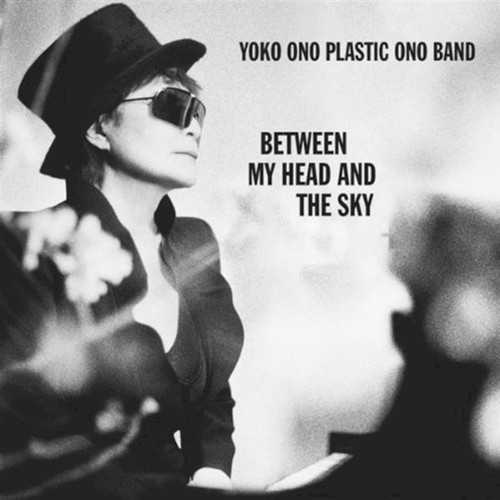 Allmusic album Review : Shes really back; one of the most gloriously influential and notorious women in the history of rock has returned with a new album at the age of 76, and thank goodness. With Between My Head and the Sky, Yoko Ono has courageously and outrageously revived the Plastic Ono Band moniker; a group she and husband John Lennon formed together; only this time, instead of the late John, its with the couples son Sean Lennon. Audacious? Oh yeah, but wait until you hear it! On 2007s Yes, Im a Witch, Ono gave a bunch of her old tracks to artists like J. Spaceman, Chan Marshall, DJ Spooky, and the Flaming Lips, to name a few, and re-recorded them. This time out, she surrounded herself with New York studio players, Seans own band, and guests such as Yuka Honda from Cibo Matto, and members of Cornelius. The end result is a stunning collection of 16 wildly diverse tracks that were written in six days and recorded very quickly. The centerpiece is an electronic-cum-acid rock spoken word peace called "The Sun Is Down," with screaming guitars, crisscrossing beats and breaks, and Honda offering sung vocal support drifting entrancingly in the backdrop. Then there is the funkier material, such as the wonderfully surreal "Ask the Elephant," with some stellar feedback and heavy guitar work by Sean, and the overtly rockist title track, where Ono speaks more emphatically than she has in decades. This isnt just rock as spoken word, its got groove, crunch, noise, and vulnerability as well as authority, and in places, yes, her trademark ululating wail. "Watching the Rain" is a midtempo ballad with shimmering blips and beats, her singing voice is expressive in its limited range, and her words are deeply moving. The shamanistic, trance-like quality of "Moving Mountains" melds acid folk and new production styles with a beautiful layer of horns -- trumpets mainly -- in the background. Come to think of it, there are a lot of trumpets on this record. Ultimately, however, Between My Head and the Sky is perhaps the most accessible album shes recorded, and yet the most forward looking, too, because it is ultimately contemporary in that it takes the past into account while pushing its margins to the breaking point and pointing to the known -- check the jazzed-up funky reggae in "Hashire, Hashire." This set is not full of ballads; there is little of the fragility of Walking on Thin Ice here, though its desire to heal individuals and the world is ever present, and has none of the overt self-conscious excesses of Plastic Ono Band projects of the past. This is a deeply focused, wonderfully colorful, and deeply expressive work that showcases a collaboration between mother and son and displays depth, strength, creativity in spades, and intense beauty. between_my_head_and_the_sky