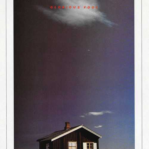 Allmusic album Review : With a new label and a big-name producer, Glorious Fool, John Martyns first release following his departure from Island Records, looked to be his best shot at mainstream acceptance. Produced by Phil Collins, who was riding a wave of popularity, and featuring Eric Clapton (who had previously recorded Martyns May You Never) on guitar, the record was his most accessible to date. The album balances the moodiness of the obliquely political title track with cuts such as the muscular drums and guitar of "Amsterdam" and "Never Say Never," as well as the Latin-flavored romanticism of "Hold On My Heart," the slick love paean "Couldnt Love You More," and the haunting, anti-war "Dont You Go." Glorious Fool, the former folkies second recording in a row to shun the acoustic guitar altogether, bears Collins stamp (thanks primarily to his drumming and vocoder-affected backing vocals) without ever obscuring Martyns strong personality. It may not have been the breakthrough some had hoped, but Glorious Fool endures as one of John Martyns best. glorious_fool