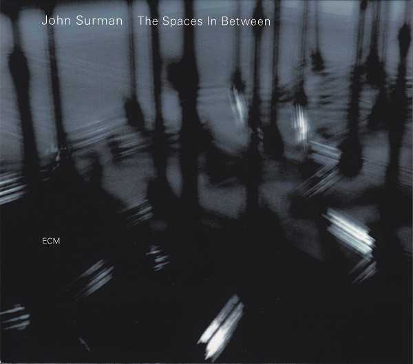 Allmusic album Review : Its been four long years since British composer and saxophonist John Surman issued a new recording for his longtime home label, ECM. In a loose way, The Spaces in Between is the mirror image of 2003s Free and Equal, recorded with drummer Jack DeJohnette and the London Brass (though that record was a mirror of the first teaming of Surman with his longtime collaborator, double bassist Chris Laurence and the then-new Trans4mation String Quartet). Surman has been writing, arranging for, and performing with Trans4mation since that time. Whereas Coruscating was far more formal in structure, and its textures and colorings plotted in advance, here there are more opportunities for the strings to improvise and add more freely to the mix. There is a beauty in this, as Surman revisits and reconstructs pieces that go all the way back to his Dawn years with the opening track "Moonlighter." Dont expect to be able to recognize this one from its former incarnation. The earlier band, in which John McLaughlin and Dave Holland played roles, was a much more fiery ensemble -- at a much louder volume -- for whom improvisation was the true prize. Here, the true treasure of the relatively spare melody Surman composed is worked from the ground up with restrained elegance by Transmation, and Laurences role is one of being a contrapuntal ballast for the saxophonist who plays baritone in a decidedly non post-Coltrane manner.<br><br> Other previously recorded Surman tunes are the lovely "Mimosa," written for the Thimar session trio with Anouar Brahem and Holland. The sheer old-world exoticism of the oud is here replaced by the slowly developing theme plucked out on the violin and then played in full by the quartet as Surman underscores those lines with short, melodic modal lines of his own, all of them resolving in passage. His soloing here is also far more engaging, allowing his own phrases to drift into one another with the end of one line suggesting the entrance of the next as Rita Mannings violin hovers and swoops in improvisation in the backdrop. Laurence enters a with a very compelling rhythm line that feels more like a solo setting, leaving Surman completely free to follow a different melodic path. In both pieces its easy to hear them dovetailing, complementing one another so well its almost as if the work was written in two distinct sections meant to be played one after another. The title cut is the hinge piece here, and occurs almost dead center. Its written as a solo violin work for Manning, and, at over eight minutes, is as striking a work as weve heard from Surman written for another instrument. Make no mistake, while there is improvisation involved here, this is a very tautly written work, where dynamic and tone demand as much control as the notes themselves. Surmans sense of space is singular. His lines are literally pregnant with meaning as they suggest not only themselves but reference other elements of both British folk traditions and its long, rich classical past while looking squarely at the 20th century and composers from Robert Simpson to Harold Truscott. What takes place after this gorgeous solo work is a much more active and lush, even bright sense of coloration and gorgeous harmonic structures to complement Surmans solos; his lovely and poetic soprano work on "Where Fortune Smiles" is a prime example, and the sprightly, paradigmatic "Leaving the Harrow," contains some of the most intricate work on the set. Its painterly in its movement, yet, at the same time suggests a look through memorys prism, the strings are so fluid and turn so quickly as Laurence plays a nearly knotty bass solo assisted by the rich, warm tonal clusters from the quartet at its beginning, and is left alone before Surman joins him for some rich and utterly lovely interplay before the strings re-enter in earnest, carrying with them the kind of drama that only the memory can illustrate. Surman may not record quite so regularly as he once did, but given how rich, varied, and thoroughly engaging and sumptuous this work is, we should perhaps celebrate the fact that we can savor his records rather than consume them. the_spaces_in_between