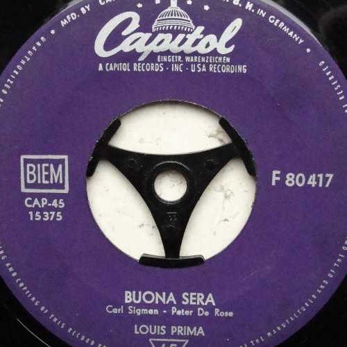 Allmusic album Review : Louis Prima, a trumpeting, band-leading apostle of King Oliver and Louis Armstrong, comes across as the entertaining extrovert in the wildly expressive tradition of Al Jolson. This collection is from Primas post-WW II nightclub period, when he had fully developed a Louis Armstrong presentation of novelty playing with a solid swing and jazz backing band. Wife Keely Smith figures prominently as a backing vocalist, and that on-it band is Sam Butera and the Witnesses. This places these songs in the late 50s, after tenor saxophonist and bandleader Butera joined and before Primas divorce from Smith. These are the Las Vegas days and the arrangements are calculated to give the audience the expected Italian dialect and swing band tricks. buona_sera