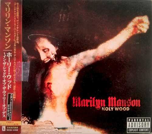 Allmusic album Review : In 2000, Marilyn Manson not only was recovering from his fans rejection of Mechanical Animals, he was scarred from Columbine and, worst of all, he was no longer Americas demon dog. What was Brian Warner to do, standing on such uneasy ground? As a smart man and savvy marketer, he knew that it was time to consolidate his strengths, blend Omega with Antichrist Superstar, and return with a harsh, controversial, operatic epic: a vulgar concept album to seduce his core audiences of alienated teens and cultural cops. The resulting album, Holy Wood (In the Shadow of the Valley of Death), is intended as the third part of the trilogy beginning with Antichrist Superstar, and its convoluted story line is fairly autobiographical, but the amazing thing isnt the story -- its that he figured out to meld the hooks and subtle sonic shading of Mechanical Animals with the ugly, neo-industrial metallicisms of Antichrist. Consequently, its easy to see this as the definitive Marilyn Manson album, since its tuneful and abrasive. Then again, much of its charm lies in Manson trying so hard, perfecting details in the concept, lyrics, themes, production, sequencing, the tarot card parodies in the liner notes, the self-theft, the self-consciously blasphemous cover art. Theres so much effort, Holy Wood winds up a stronger and more consistent album than any of his other work. If theres any problem, its that Mansons shock rock seems a little quaint in 2000. Eminems vibrant, surrealistic white-trash fantasias were the sound of 2000, while Marilyn Mansons rock operas, religious baiting, and goth gear are from an era passed. Its to Warners credit as, yes, an artist that Holy Wood works anyway. holy_wood_in_the_shadow_of_the_valley_of_death