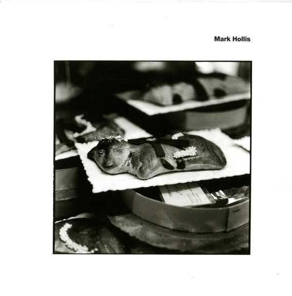 Allmusic album Review : Achingly gorgeous and hauntingly stark, Mark Hollis self-titled debut picks up where he left off with Talk Talks Laughing Stock seven years earlier, re-emerging at the nexus point where jazz, ambient, and folk music collide. Its quite possibly the most quiet and intimate record ever made, each song cut to the bone for maximum emotional impact and every note carrying enormous meaning. Hollis paints his music in fine, exquisite strokes, with an uncanny mastery of atmosphere thats frequently devastating. And if anything, his singularly resonant voice has grown even more plaintive with the passage of time, which -- combined with the understated artistry and minimalist beauty of tracks like "The Colour of Spring" and "Watershed" -- makes Mark Hollis a truly unique and indelible listening experience. His obvious understanding of the power of silence aside, one prays he doesnt again wait for the seven-year itch to strike before returning. mark_hollis
