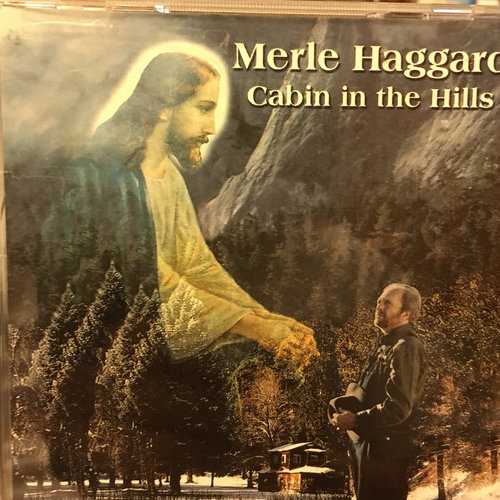 Allmusic album Review : A Bakersfield-style collection of spirituals, either penned or arranged by Haggard, with the exception of Iris Dements sublime "Shores of Jordan" and Brumley and Brumleys "This World Is Not My Home." Self-produced and put out on his own label, Hag, Haggard is joined on dobro and steel guitar by Norman Hamlet and on vocals by Porter Wagoner and Bonnie Owens, with whom Haggard dueted on his second hit single, the 1964 release "Just Between the Two of Us." Haggards own spiritual evolution, which took root while in solitary confinement at San Quentin prison, lends grit and intrigue to this highly listenable set. cabin_in_the_hills