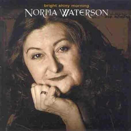 Allmusic album Review : Although Norma Waterson has been a fixture of the English folk scene for 35 years, Bright Shiny Morning is only her second solo album (her first, Norma Waterson, was released in 1996). She has remained a fixture due to her resonant voice and the depth of her interpretations of traditional English songs. From "The Chaps of Cockaigny" to "My Flower, My Companion & Me" Watersons voice stands front and center, filled with romantic trills and often expressing a deep sadness. The individual arrangements add spice to this material, from the piano accordion on "Three Maids A-Milking" to the brass of "Barbary Allen." "Game of All Fours" is sung without accompaniment, recalling other traditional singers like Anne Briggs. Waterson writes, "All these songs, one way or another, are love songs," but love doesnt always go as one would like it to. Indeed, "One April Morning" carries the unhappy refrain, "Young men are false/young men they are deceitful." "Green Grows the Laurel" finds the narrator sadly parted from her lover, turned out of her home, and left to ramble with her baby. The artist receives a great deal of support from Eliza Carthy, Martin Carthy, and harp player Mary Macmaster, each tastefully adding touches that serve the voice of the singer. Eliza Carthy also receives credit for the fine production of Bright Shiny Morning, which has a crisp, vivid sound-brighter perhaps than one might expect for strict traditional music, but it works perfectly. Waterson has created a lasting artistic statement, and fans can only hope that she doesnt wait quite as long for her next effort. bright_shiny_morning