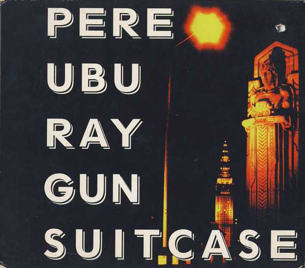 Allmusic album Review : Returned to indie label status for their tenth studio album, Pere Ubu again made music in the style familiar from their earliest recordings -- staccato rhythms and noisy guitars backing David Thomas disjointed singing of repeated, obscure lyrics. Typical was "Vacuum in My Head" (with some of the ominous tone of "30 Seconds Over Tokyo"), in which Thomas spoke-sang, "Vacuum cleaner in my head/It sucks up everything I know." The playing often had more delicacy and precision than early on, and Thomas varied his effects from mutters to shrieks. An acoustic guitar rendition of the Beach Boys "Surfer Girl" was a distinct change of pace, even if its author, Brian Wilson, might not have recognized it in Thomas performance. But Ray Gun Suitcase was an album for the cult of fans who delighted in the bands offbeat lyrical viewpoint and musical cacophony, which was just as well, since the more conventional orientation attempted in the late 1980s and early 90s did not pay off in an expanded following. ray_gun_suitcase