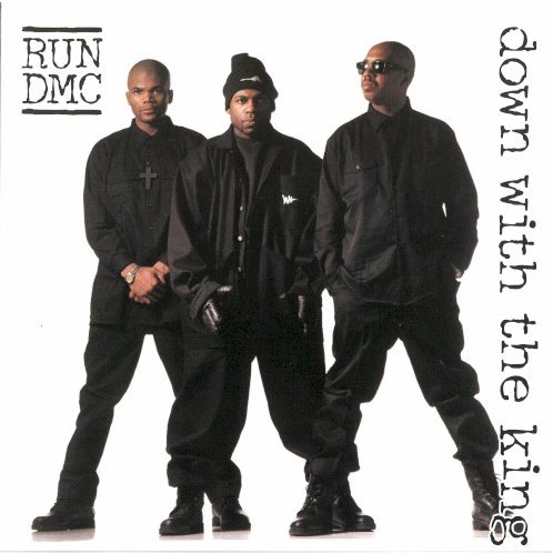 Allmusic album Review : After the poor response of Back from Hell, Run-D.M.C. decided to make some drastic changes. Their first point of order was to rebuild their dwindling street cred and reiterate their proven track record as the kings by compiling a best-of compilation. Simultaneously, they started work on a fresh and current-sounding album with the help of some of the hottest artists and producers in the rap game. Retreating from the funky new jack swing that overwhelmed Back from Hell, they enlisted Pete Rock, Q-Tip, EPMD, Naughty by Nature, the Bomb Squad, and Jermaine Dupri to help produce Down with the King. The new sound is decidedly more fashionable, and their fedoras and Adidas are abandoned here for bald heads and baggy black hoodies to match their new gangsta musical direction; which takes an obvious cue from Onyx (signed to Jam Master Jays label), whose "Slam" was a platinum hit earlier in 1993. Instead of using the intersecting back-and-forth wordplay that launched their career, this new incarnation of Run-D.M.C. incorporates the trendy "grimy" sound with ensemble shouts over specific lyrical parts (think Leaders of the New School). The beats are less corny, less funk-inspired, and more jazzy and sinister, with ominous basslines, organs, and delayed horn samples, and the vocals are more raucous and angry. Longtime fans will wonder why the trio isnt staying true to its past, especially when Run borrow from newcomers Das EFX with "stiggitys" and "riggitys," but the album serves its purpose of winning over a new generation of fans, and old-timers can find solace in the fact that rock is incorporated again in "Big Willie," a throwback to "Rock Box" with a rippin guitar part from Rage Against the Machines Tom Morello. While less original than their earlier classic albums, this is an impressive showing from a rap group thats been together ten years, and is pretty damn innovative in its own right. down_with_the_king