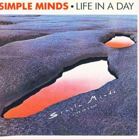 Allmusic album Review : Simple Minds astonishingly rapid ascent from humble and derivative post-punk to platinum and transcendent art pop is just as remarkable as the descent that followed it. More remarkable is the fact that a fair portion of the bands fans have such a strict discographical line in the sand drawn -- right at the chart-crashing masterpiece that is New Gold Dream -- where both sides overlap but dont dare cross. While fans of the bands earlier work essentially drop off with that record (and choose to live in blissful denial that the band existed after that), those on the other end are more or less oblivious to whats on the other side. So whats on that other, earlier side? Five studio albums released within the span of three years. Five studio albums that range from safe to bold, from impenetrable to accessible, from strange to puzzling, and from good to pee-your-pants phenomenal. Life in a Day, the first of the five records released during this fascinating pre-fame period of Simple Minds career, is easily the least of the first five. On their debut, they seem to run with a template based on the jittery bounce of Roxy Musics "Virginia Plain" and the keyboard-accentuated lunatic punch of Magazine, a band that had released their own debut a year prior to Life in a Day. (Simple Minds would later release an album with the same title, Real Life. Coincidence?) Despite the growing pains, this is a skilled and assured assemblage of guitar-heavy post-punk, with Jim Kerrs over-caffeinated yelp taking the lead role. The arrangements are full, direct, and sharply executed. The high points: the teeter-tottering title track and the J. Geils Band-like swagger (honestly!) of "Someone." The low point: "Pleasantly Disturbed," an epic Velvet Underground-inspired limp that lasts eight very long minutes. life_in_a_day