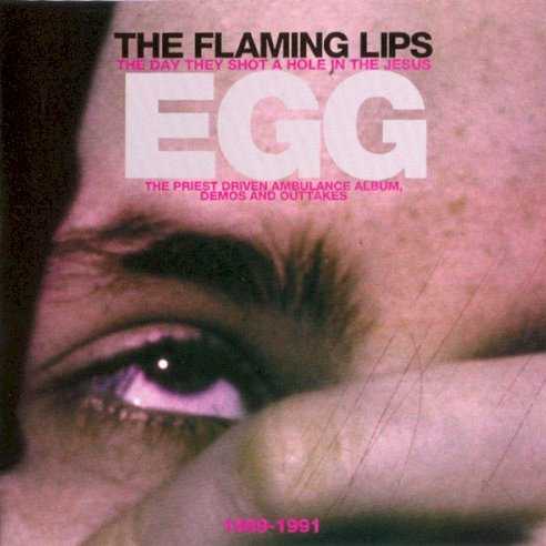 Allmusic album Review : Nothing proves a bands ambitions, or probes its emotions (or both) quite like a concept album. So, after adding guitarist Jonathan Donahue and enlisting producer Dave Fridmann, the Flaming Lips focused on Wayne Coynes ongoing quest for metaphysical enlightenment to record their first great album, In a Priest Driven Ambulance. The contributions of Donahue and Fridmann were immediately apparent, the duo appearing simultaneously as supremely fitting voices to frame Coynes brilliantly shambling lyrics and sun-scorched delivery. The songs improved as well, ranging from the freak-out epic "Unconsciously Screamin" to the pummeling "God Walks Among Us Now" to a late-night acoustic ballad like "There You Are," and, for the closer, an irony-free cover of the optimists anthem "(What A) Wonderful World." The Day They Shot a Hole in the Jesus Egg, a two-disc set of Flaming Lips recordings from 1989 to 1991, reissues the complete In a Priest Driven Ambulance and adds (in effect) 23 bonus tracks -- comprising B-sides (from the singles "Drug Machine" and "Unconsciously Screamin") plus a collection of four-track demos often bootlegged as The Mushroom Tapes. Of the extra material, the B-sides are best, especially a pair of covers: one of the Sonics sullen garage nugget "Strychnine" and the other of Elvis Costellos "(Whats So Funny Bout) Peace, Love and Understanding." Most of the demos add little to the released versions, one exception being a nice new guitar line on a version of "Unconsciously Screamin." The demos of previously unreleased songs fare a little better, including the bizarre, stream-of-consciousness jams "Gods a Wheeler Dealer" and "Agonizing," with both Coyne (on vocals) and Donahue (on guitar) apparently improvising their lines to hilarious effect. Elsewhere, "I Want to Kill My Brother; The Cymbal Head" begins with some furious strumming (straight out of the Whos "Pinball Wizard"), but never really becomes a song. As long as listeners never succumb to exhaustion from working their way through extra material that more than triples the running time of the original LP, The Day They Shot a Hole in the Jesus Egg ably demonstrates the genesis of the Flaming Lips as rock & roll saviors. the_day_they_shot_a_hole_in_the_jesus_egg