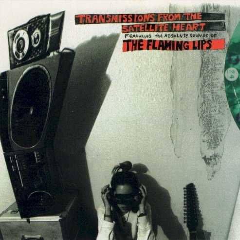Allmusic album Review : The addition of guitarist Ronald Jones and drummer Steven Drozd recharges the Flaming Lips batteries for the superb Transmissions From the Satellite Heart, another prismatic delicacy that continues the groups drift toward pop nirvana. In typical fashion, the records left-field hit, the freak-show singalong "She Dont Use Jelly," bears little resemblance to the album as a whole; the remainder of Transmissions is much more sonically and structurally ambitious -- the towering "Moth in the Incubator" keeps generating new layers of noise before erupting into an amphetamine waltz, "Pilot Can at the Queer of God" dive-bombs with kamikaze recklessness, and the slow-burning "Oh My Pregnant Head" is as mind-expanding as its title. transmissions_from_the_satellite_heart