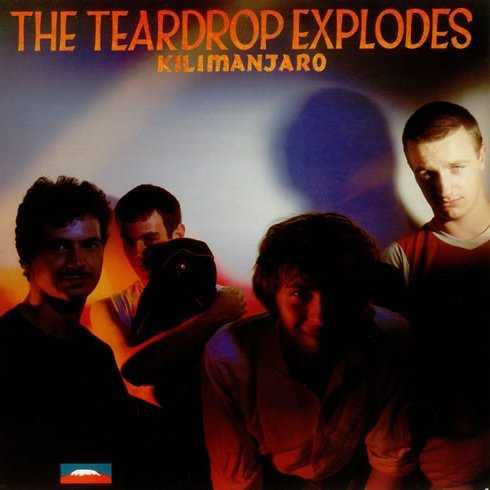 Allmusic album Review : Armed with trumpeters Ray Martinez and Hurricane Smith who add soaring flourishes and energetic blasts throughout, on Kilimanjaro the Teardrops explode in a torrent of creative, kicky and often downright fun songs that hotwire garage/psych inspirations into something more. Steering clear of ham-handed attempts to be commercially "new wave" while at the same time sounding young, bright and alive, the foursome go happily nuts with great results. Cope is already a commanding singer and frontman; his clever lyrics and strong projection result in a series of confident performances, whether his trading lines with himself on the motorik chug of "Sleeping Gas" or his yelps on "Books." For all the bad energy between himself and Balfe, the two sound like theyre grafted at the hip throughout, the latters keyboard washes and staccato melodies adding the fun, nervy vibe. Dwyers spot-on drumming keeps the pace, while both guitarists, Finkler and his replacement Gill, dont drown the band in feedback to the exclusion of everything else. One listen to many of Gills pieces, on songs like "Poppies," and Copes oft-stated claim that early U2 was trying to rip off the Teardrops and other Liverpool/Manchester groups makes sense. Though it was assembled from a variety of different sessions Kilimanjaro still sounds cohesive. Perfectly hummable choruses, great arrangements and production and Copes smiling vibe all add up with fantastic results. The sweet romance of "When I Dream" closes out this entertaining debut.