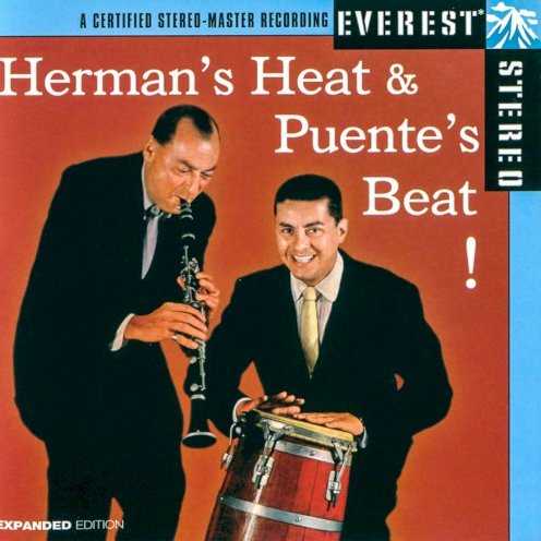 Allmusic album Review : Tito Puente and Woody Herman teamed in 1958 for a mutually satisfying meeting in the same way that Charlie Parker, Dizzy Gillespie, and Machito found common ground in the late 40s. Puentes Latin rhythms and beats meshed with the swing and bebop of Hermans band on half of the discs cuts, and the results were hot and delightful. With Puente heading the rhythm section and playing timbales, Robert Rodriguez on bass, and assorted percussion from Gilbert Lopez, Raymond Rodriquez, and Ray Barretto, the band stays locked into the Latin groove while the saxophonists and trumpeters weave in, out, and around the beat. There are also more conventional Herman swing numbers such as "Blue Station" and "Woodchoppers Ball," where the standard Herman stomping sound is in effect. hermans_heat_puentes_beat